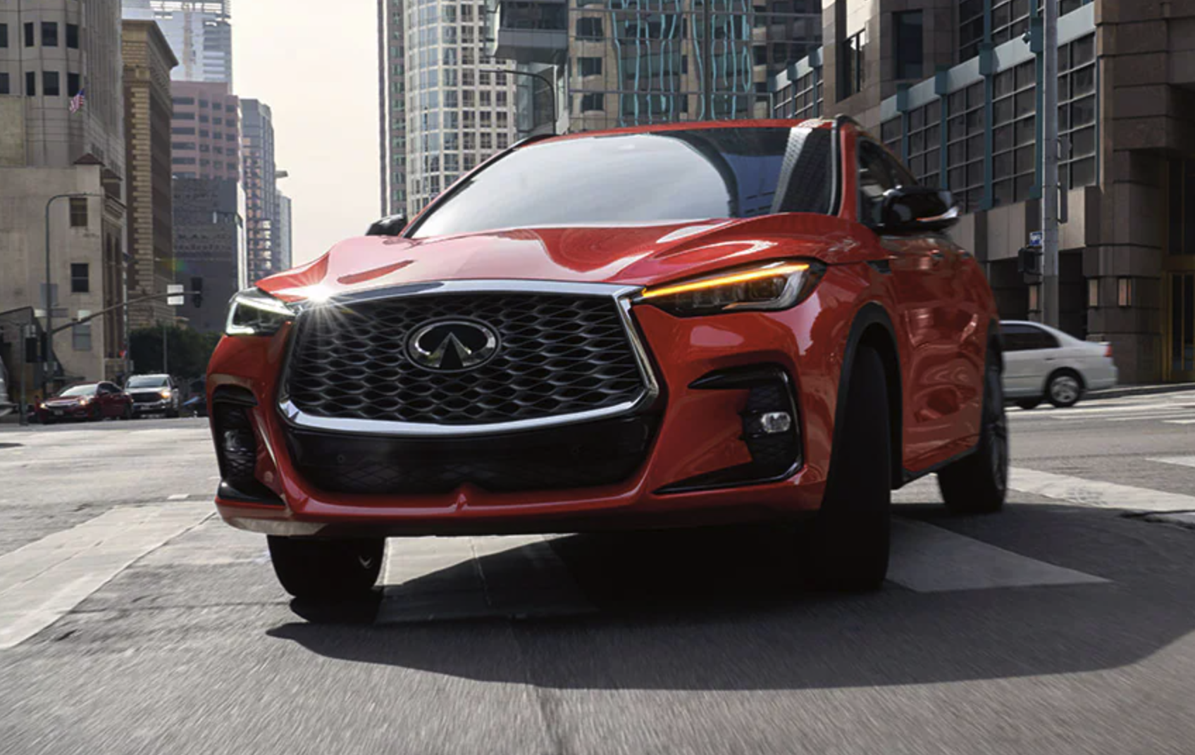 Infiniti driving in a city