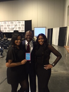 Dealership rep at Black Family expo photo op