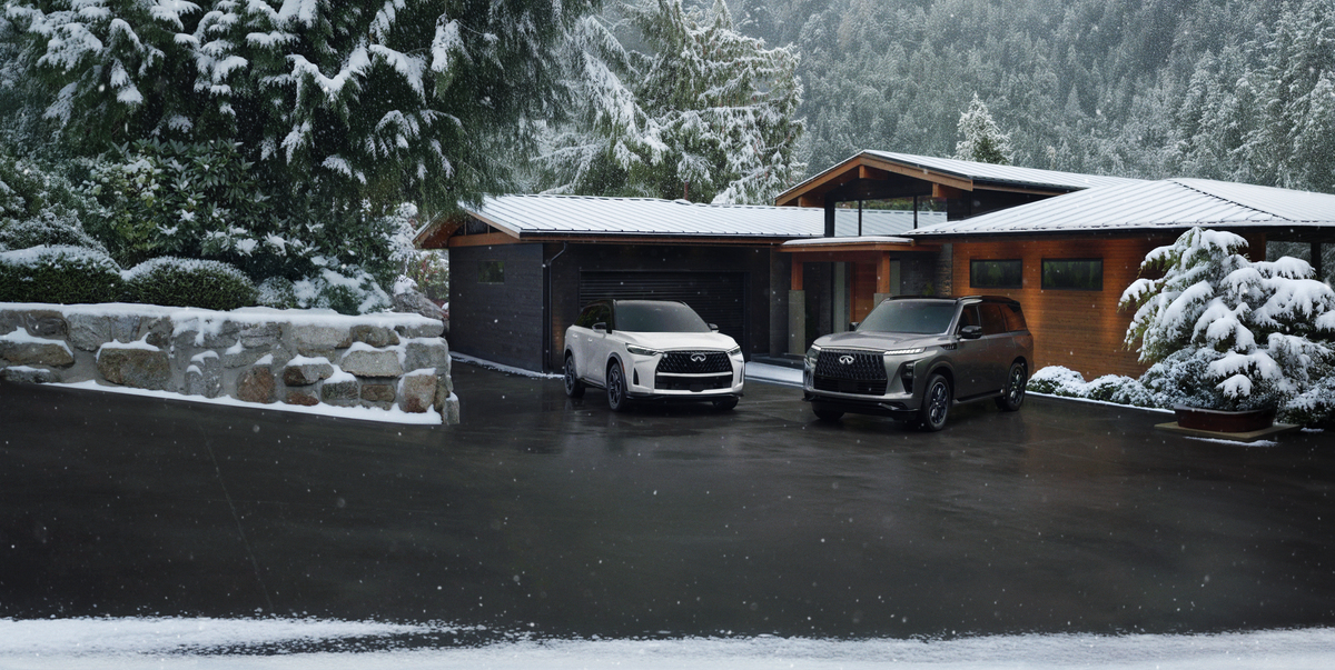 INFINITI models in front of house in the snow